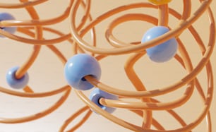 a bunch of blue and yellow balls hanging from a wire