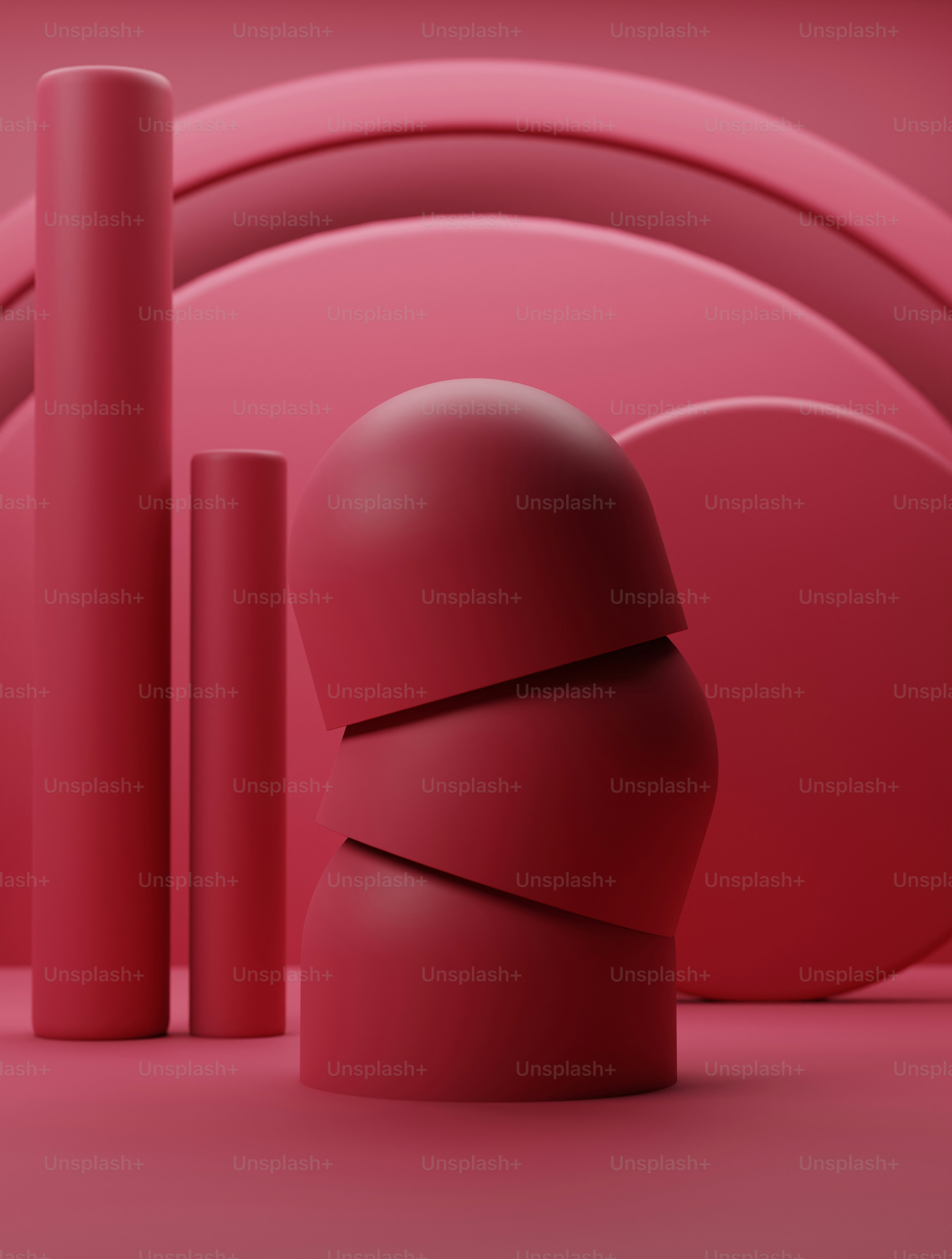 A group of red objects sitting on top of a pink floor photo – Wallpaper ...