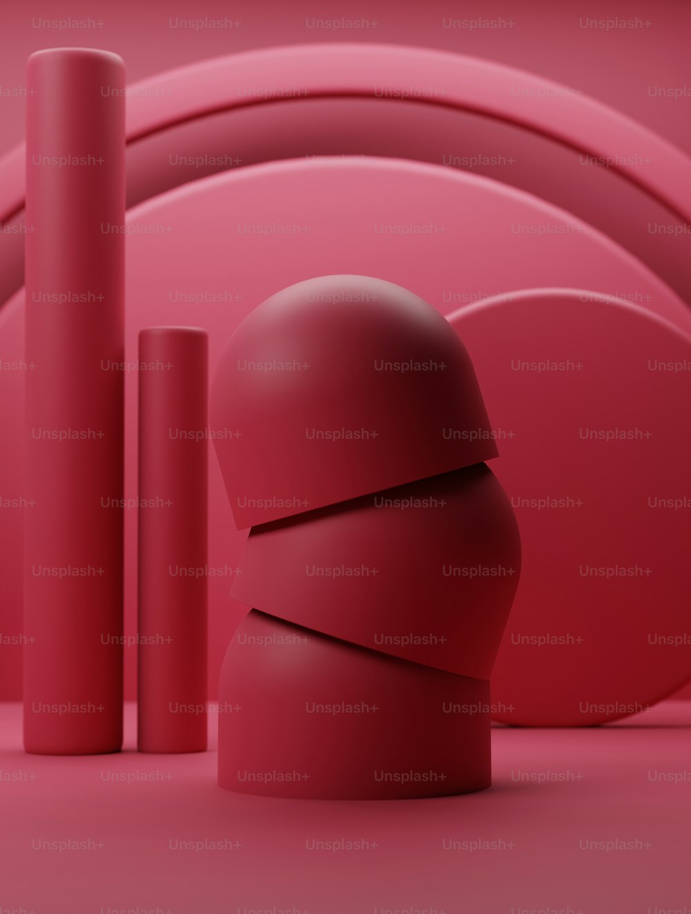 a group of red objects sitting on top of a pink floor