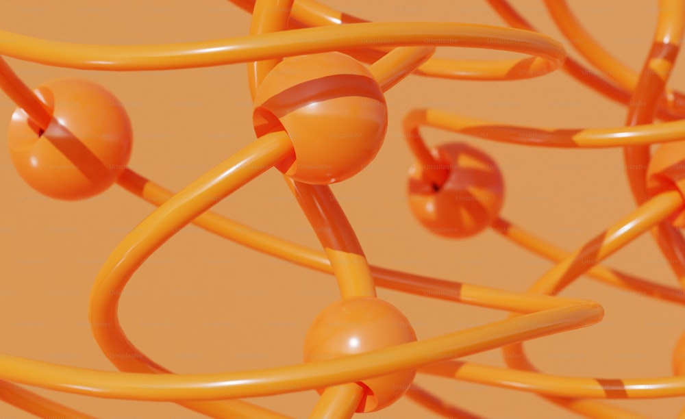 a bunch of orange wires with some balls on them