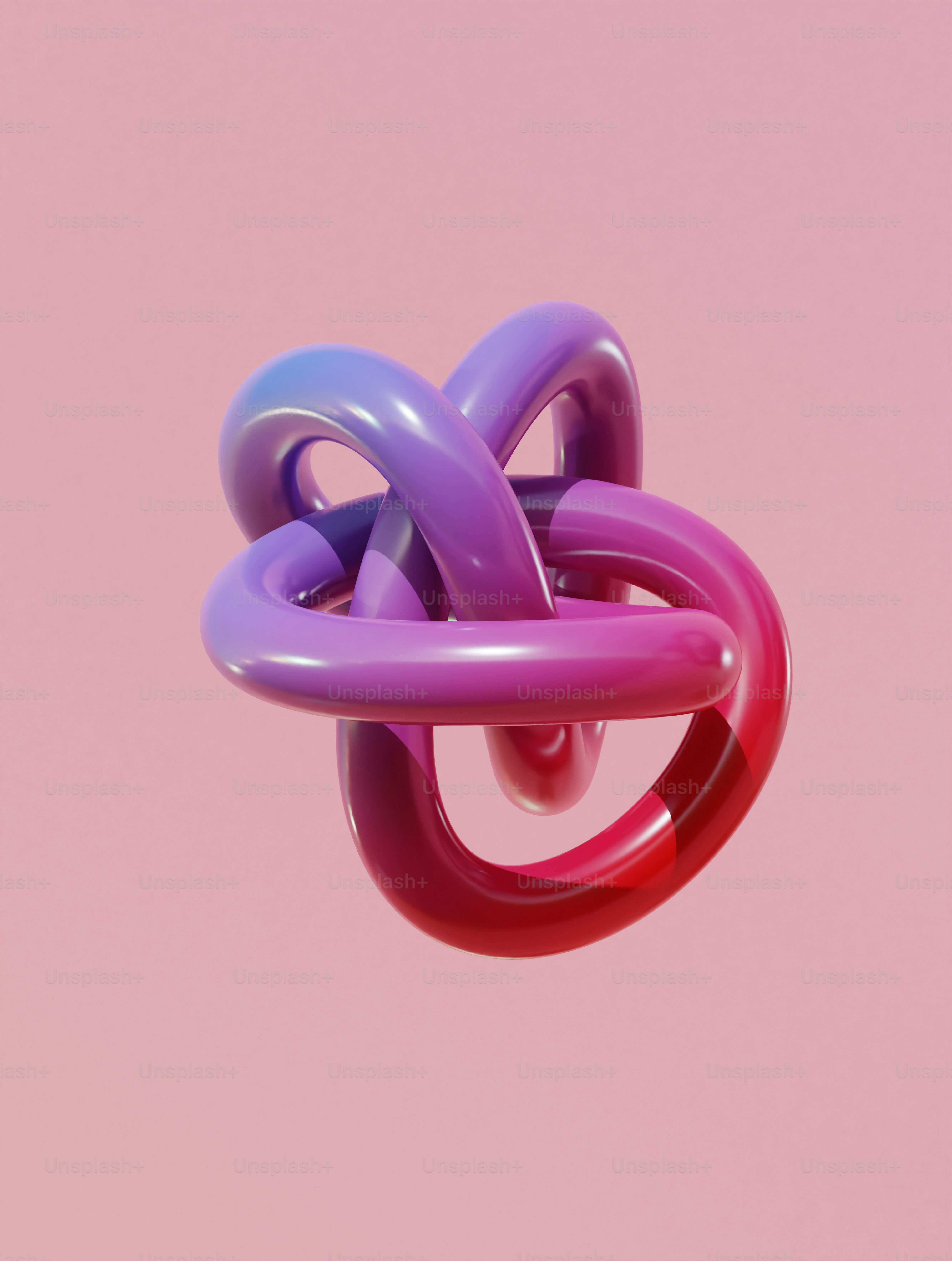 Ein rosa, lila und rotes Objekt, das in der Luft schwebt