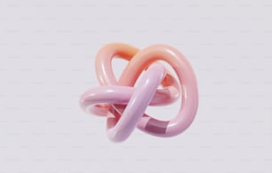 un anillo rosa y rosa con un fondo blanco