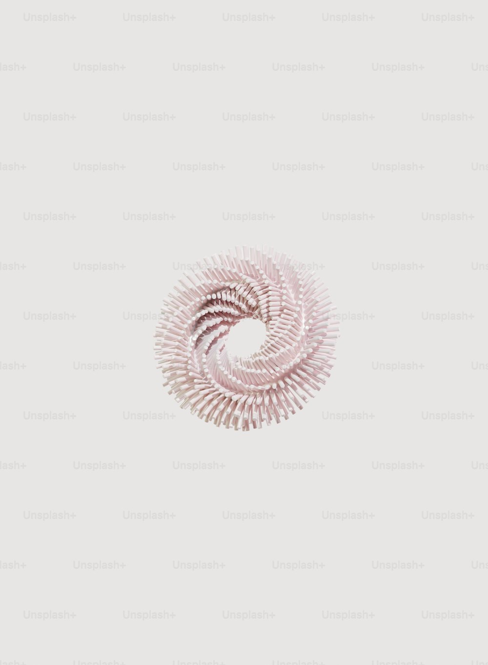 Un objet en spirale est représenté sur un fond blanc