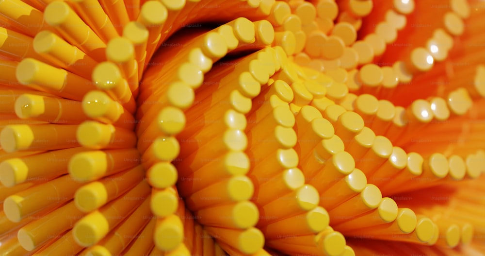 a close up of a bunch of yellow pencils