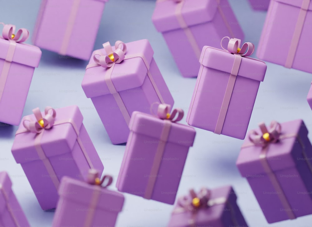 Eine Gruppe lila Geschenkboxen mit Schleifen