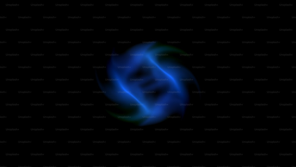 a dark background with a blue and green swirl