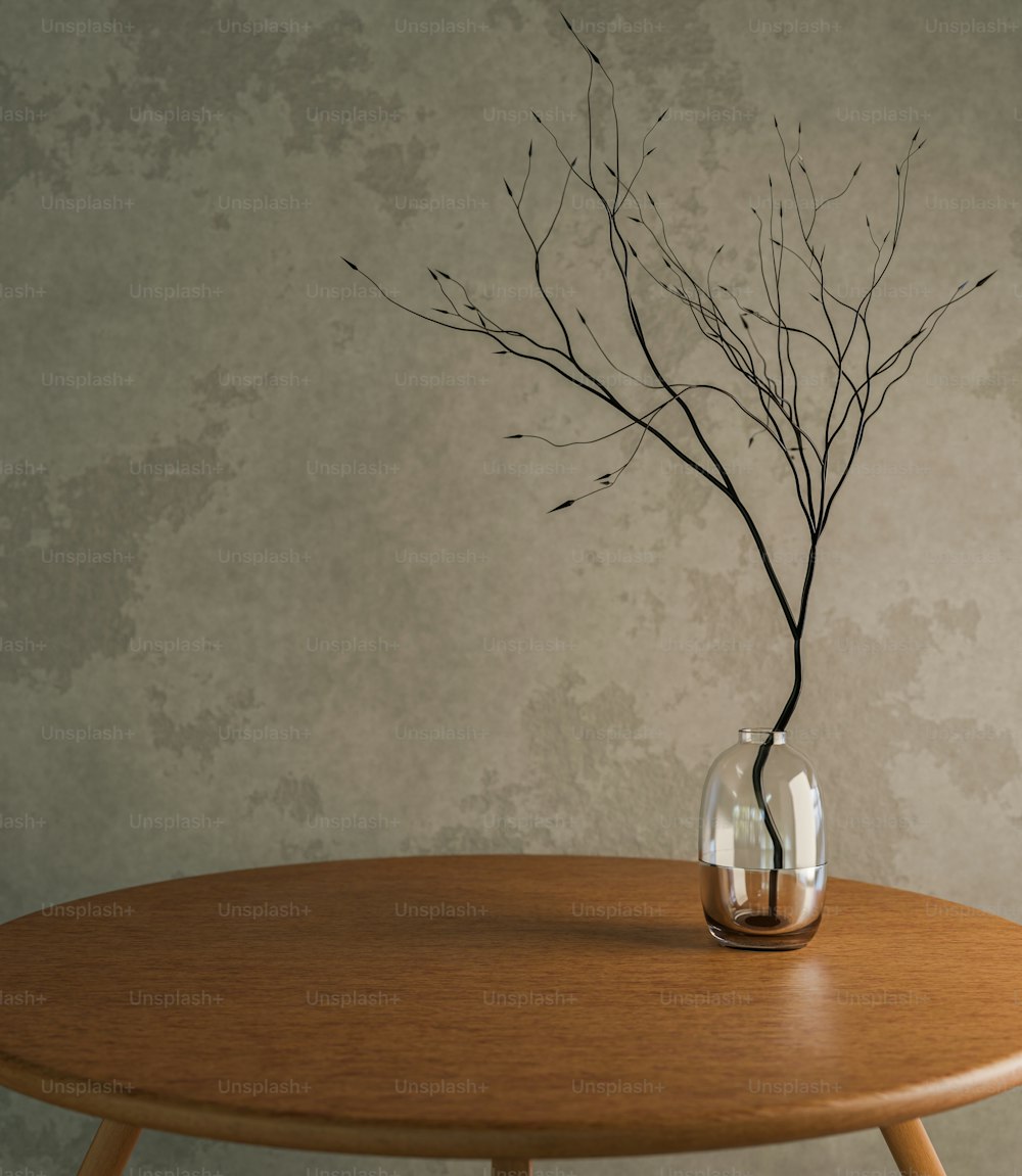 a wooden table with a vase with branches in it