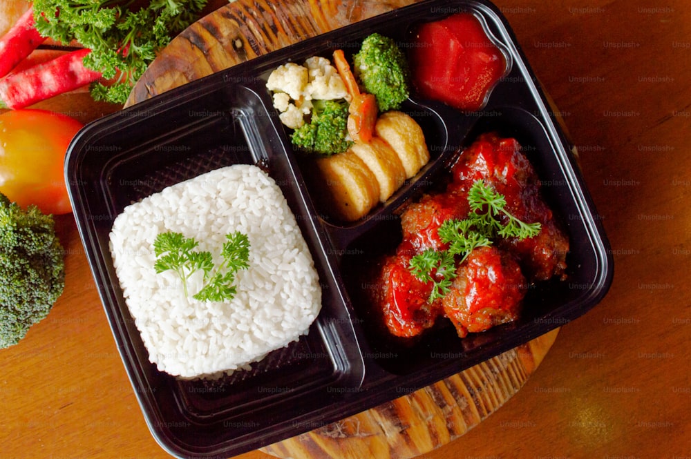 a plastic container filled with different types of food