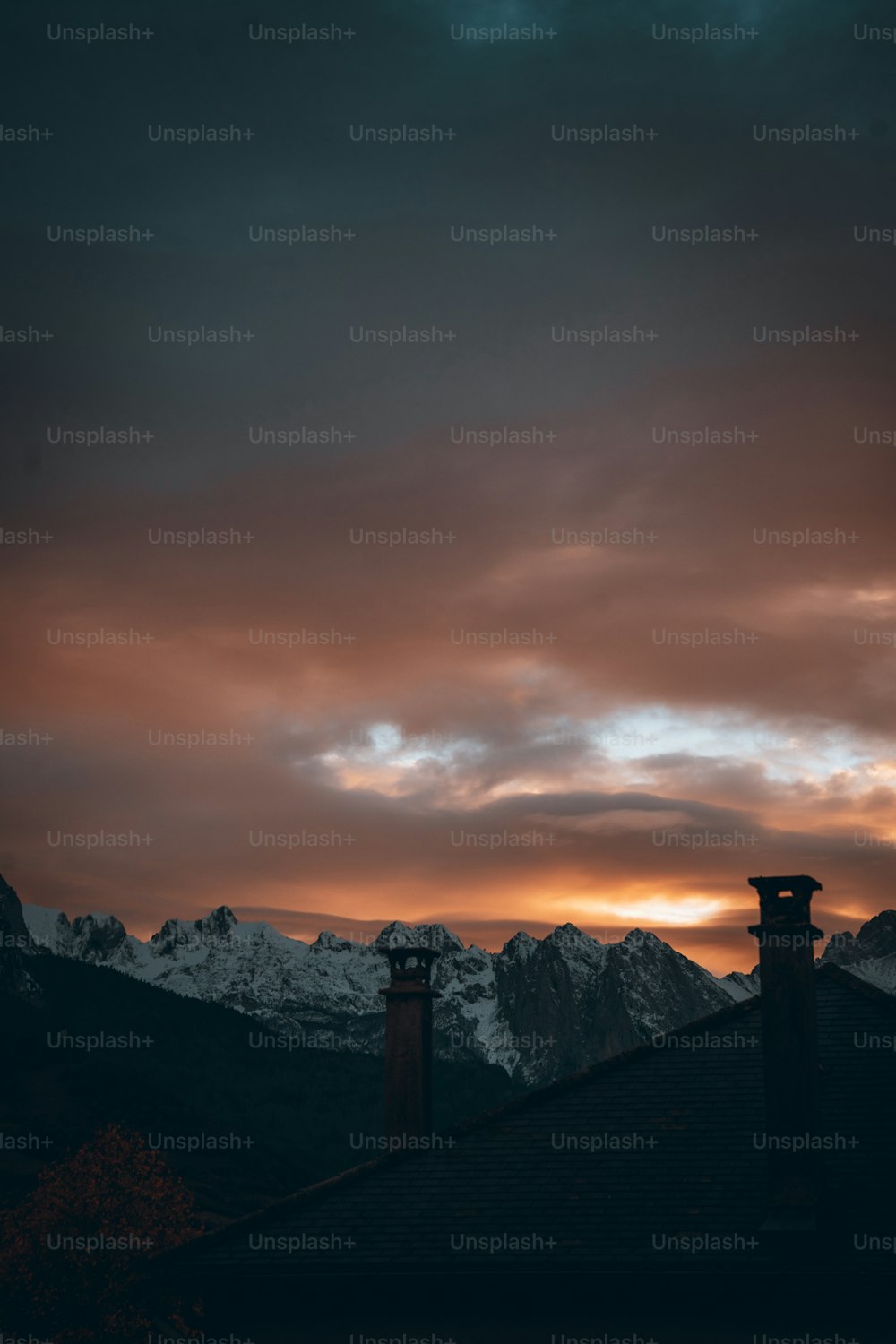 a view of a mountain range at sunset