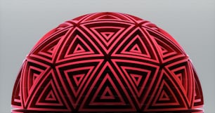 a close up of a red object on a gray background