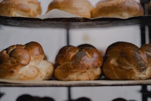a bunch of breads that are on a rack