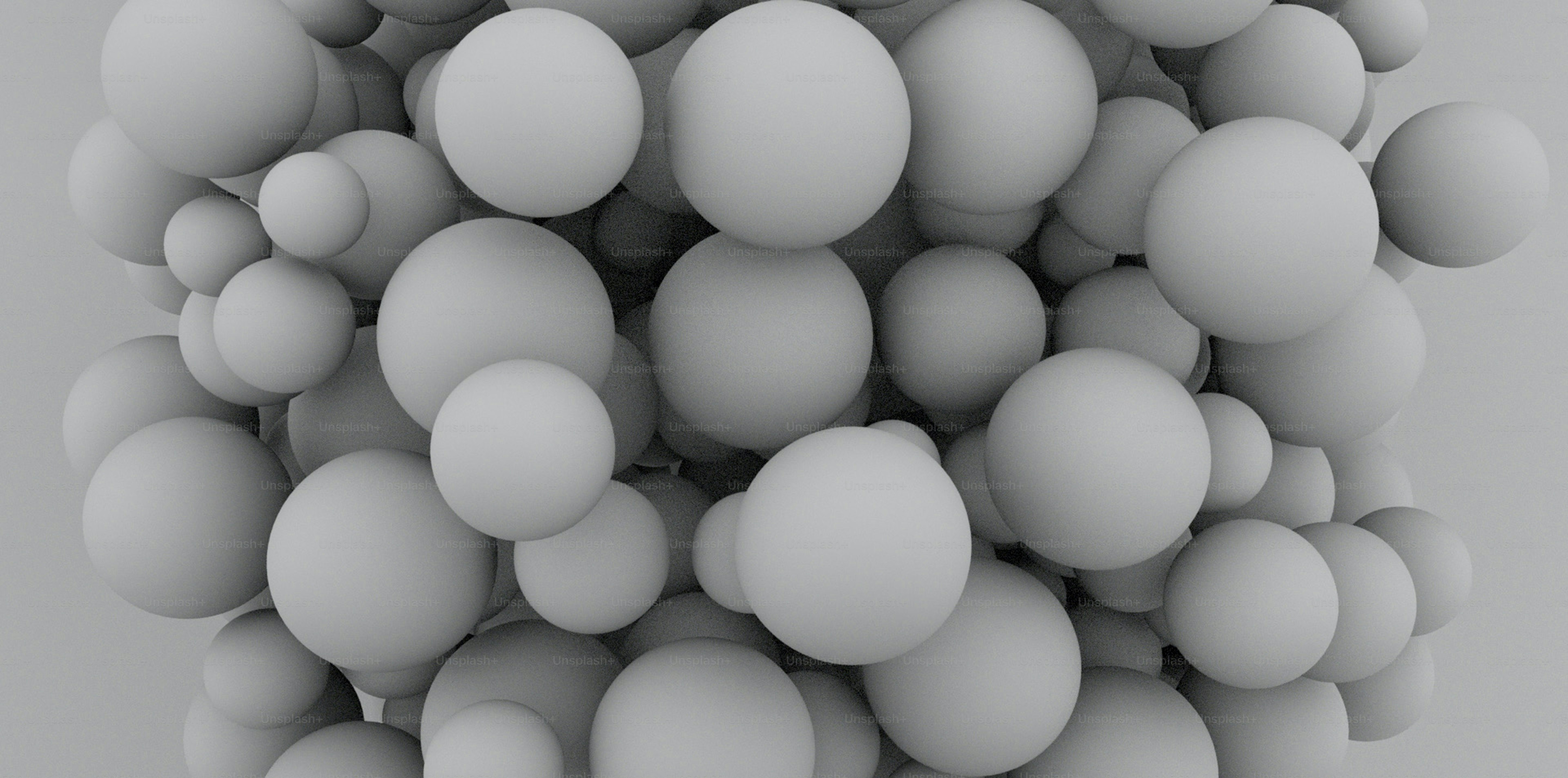 a bunch of white balls are in the air