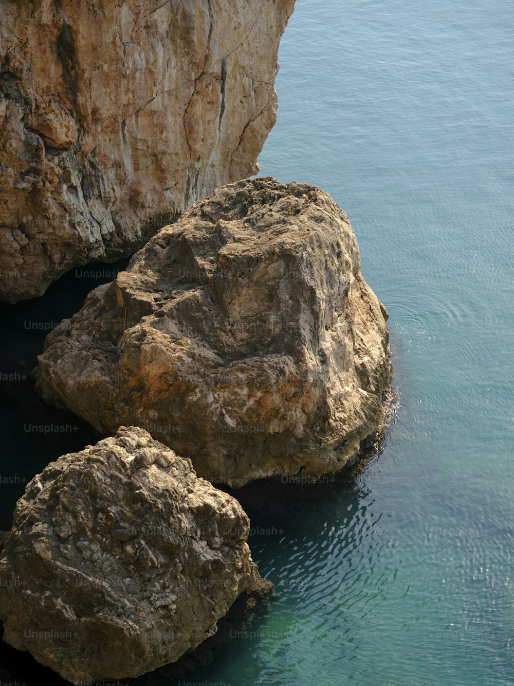 two large rocks sticking out of the water