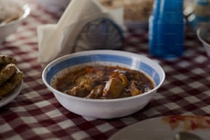 a bowl of food sitting on top of a table