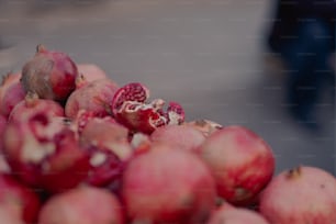 a pile of pomegranates sitting on top of each other