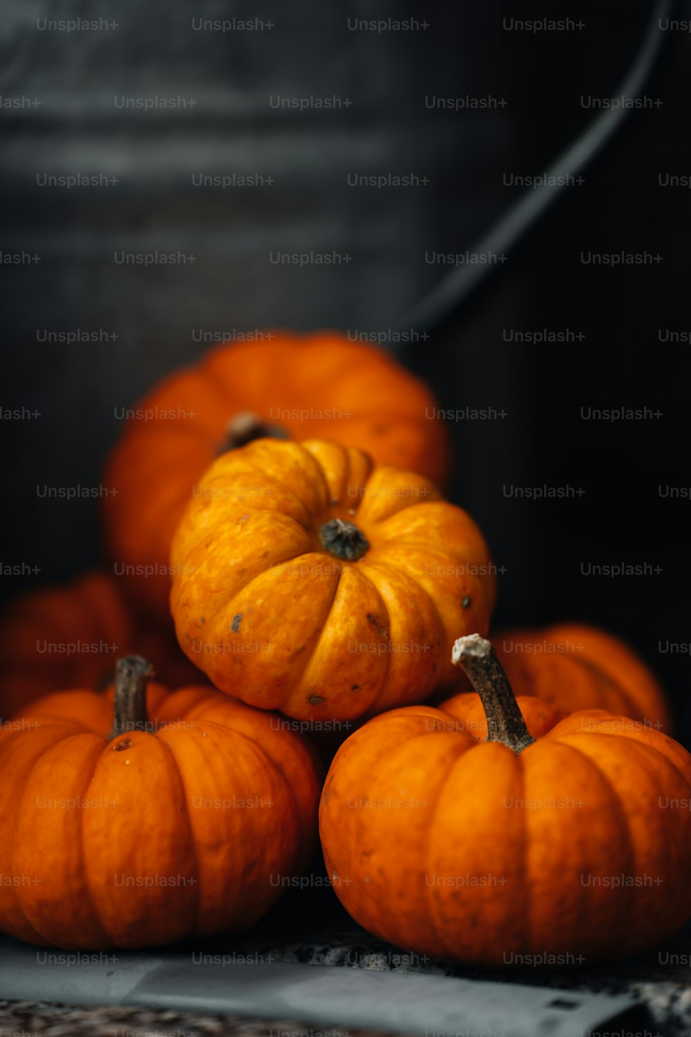 a pile of pumpkins sitting on top of a table