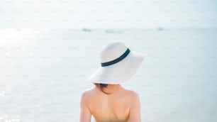 Black of beautiful woman in red swimsuit on the beach