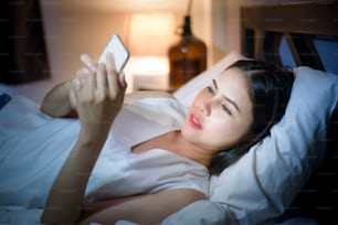 Woman is feeling eye pain when using smart phone at night