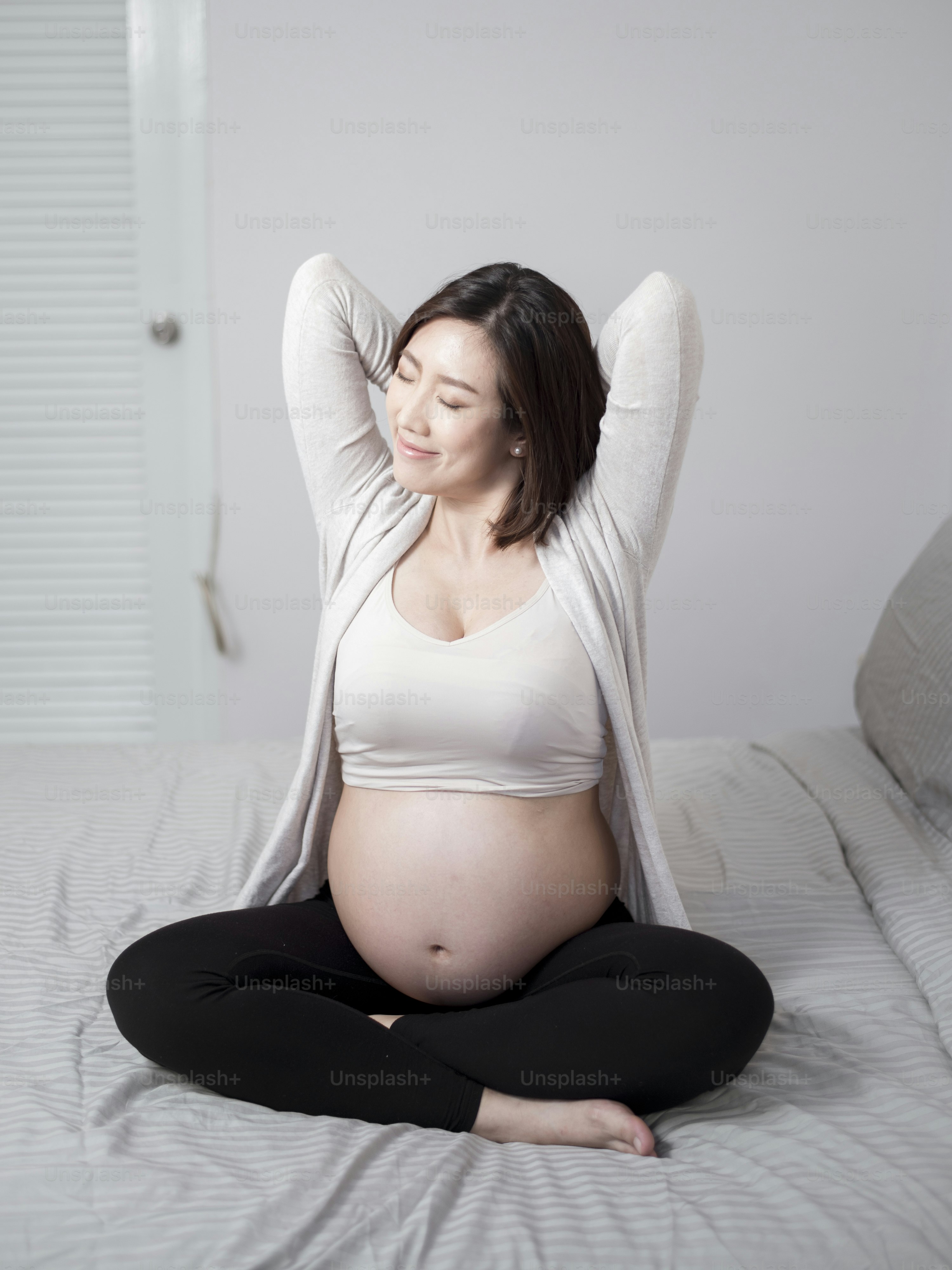 Beautiful asian pregnant woman is wake up photo – Stretching Image on Unsplash