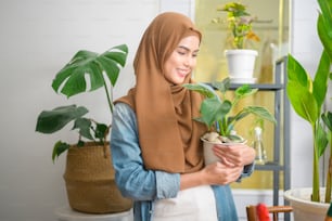 A happy young muslim woman enjoying  and relaxing leisure activity in garden at home