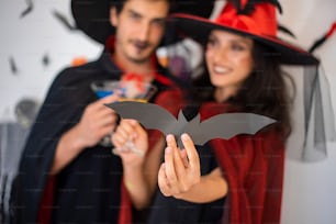 happy couple of love  in costumes and makeup on a celebration of Halloween