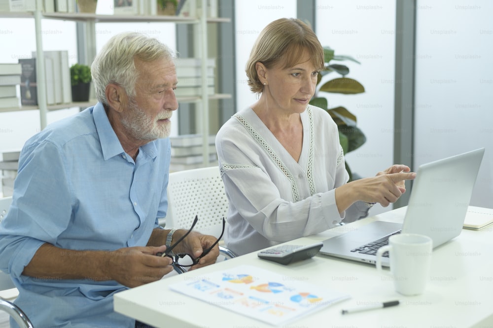 Caucasian senior people holding credit card, shopping online concept