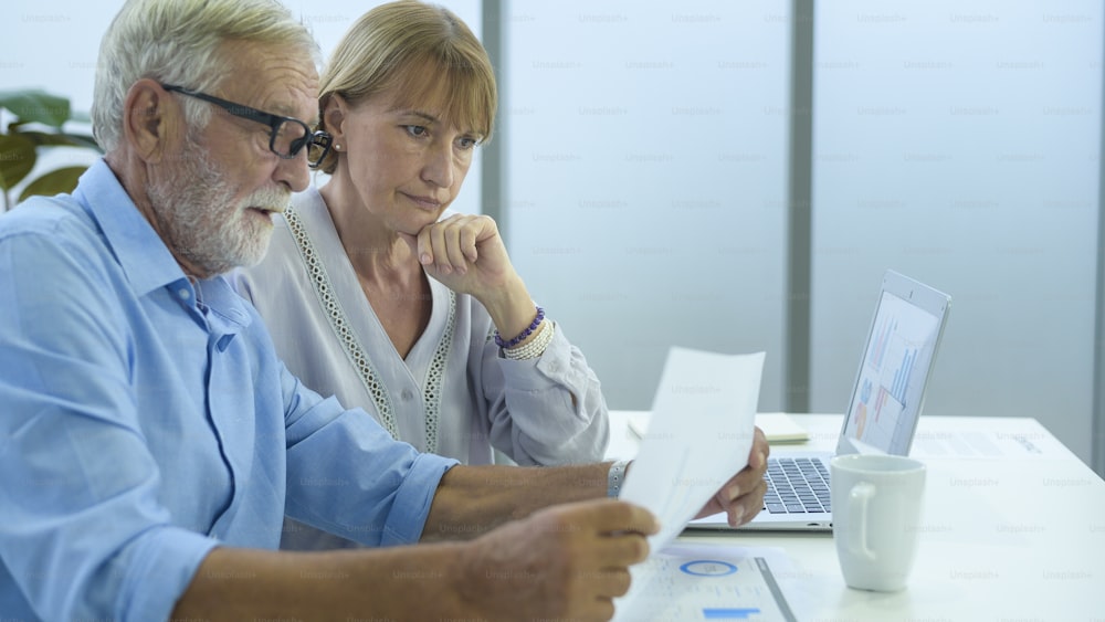 Caucasian senior Business people working and brainstorming in modern office