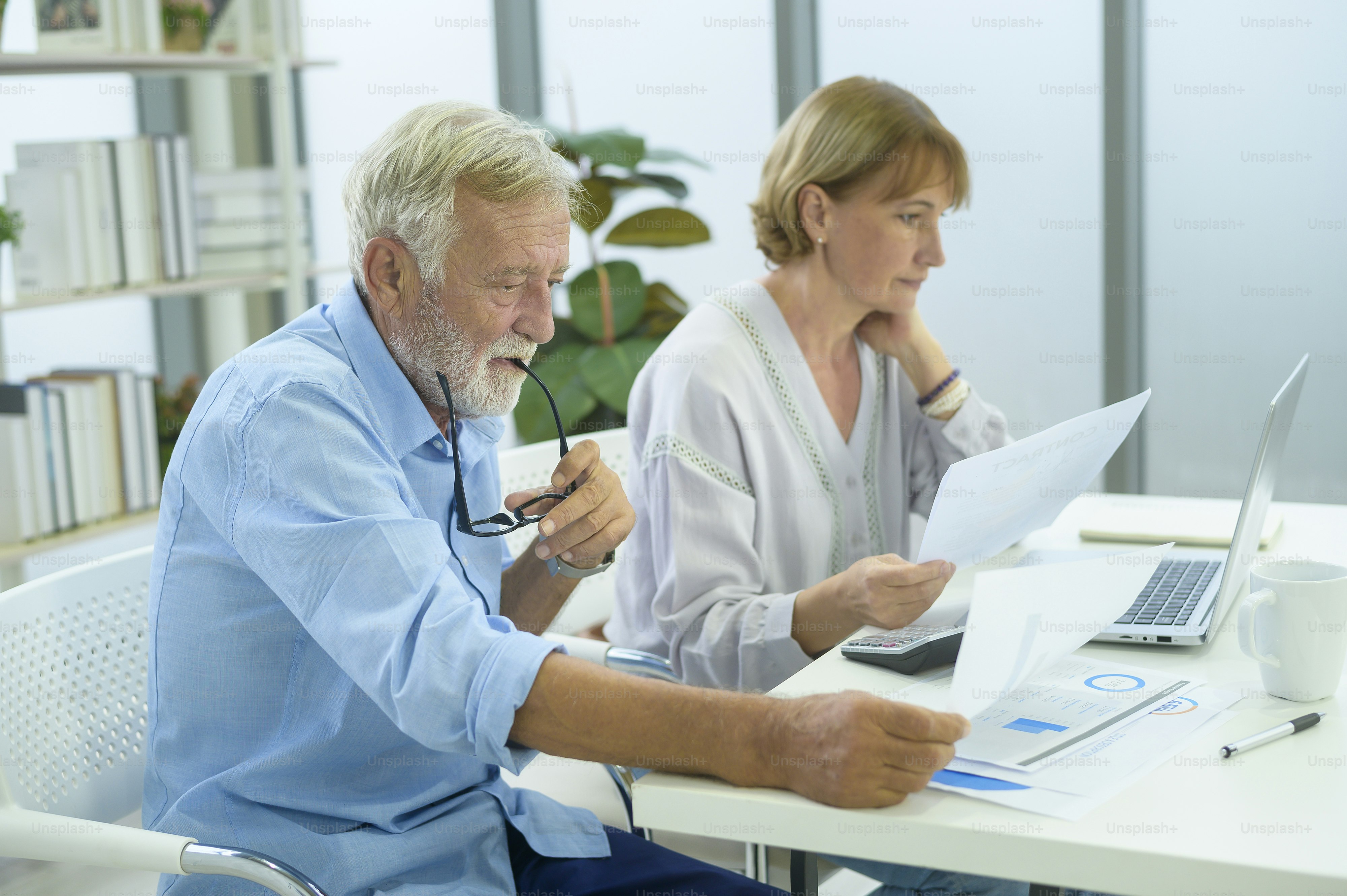 Caucasian senior Business people working and brainstorming in modern office