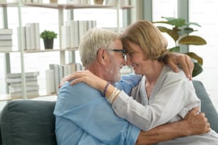 Happy Caucasian senior couple relaxing in living room  at home