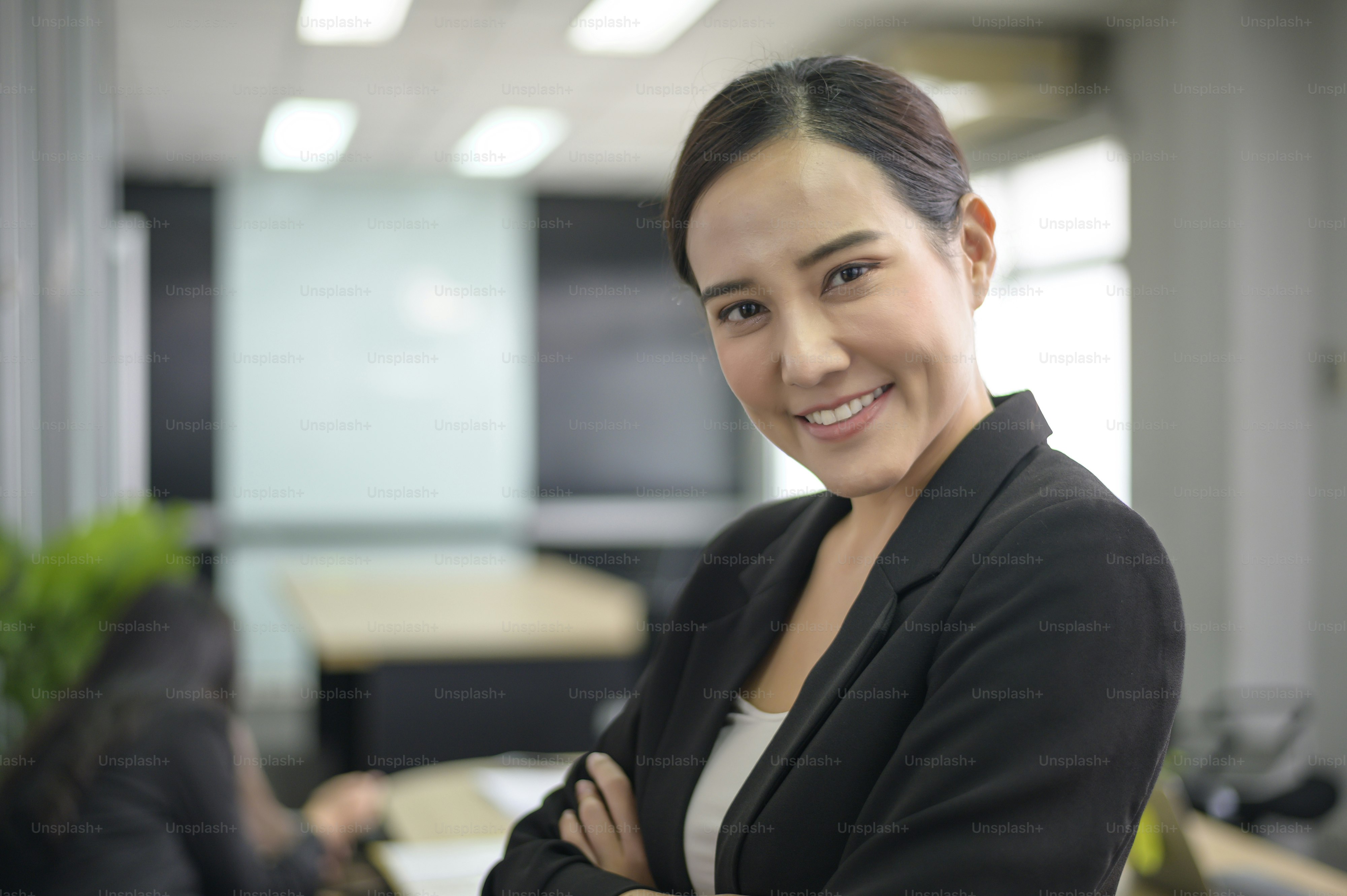 Portrait of Asian business woman is smiling in office