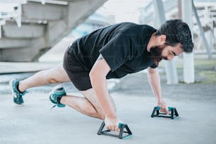 a man is doing push ups with a pair of shoes