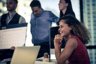 Young coworkers. Young modern colleagues in smart casual wear working while spending time in the office