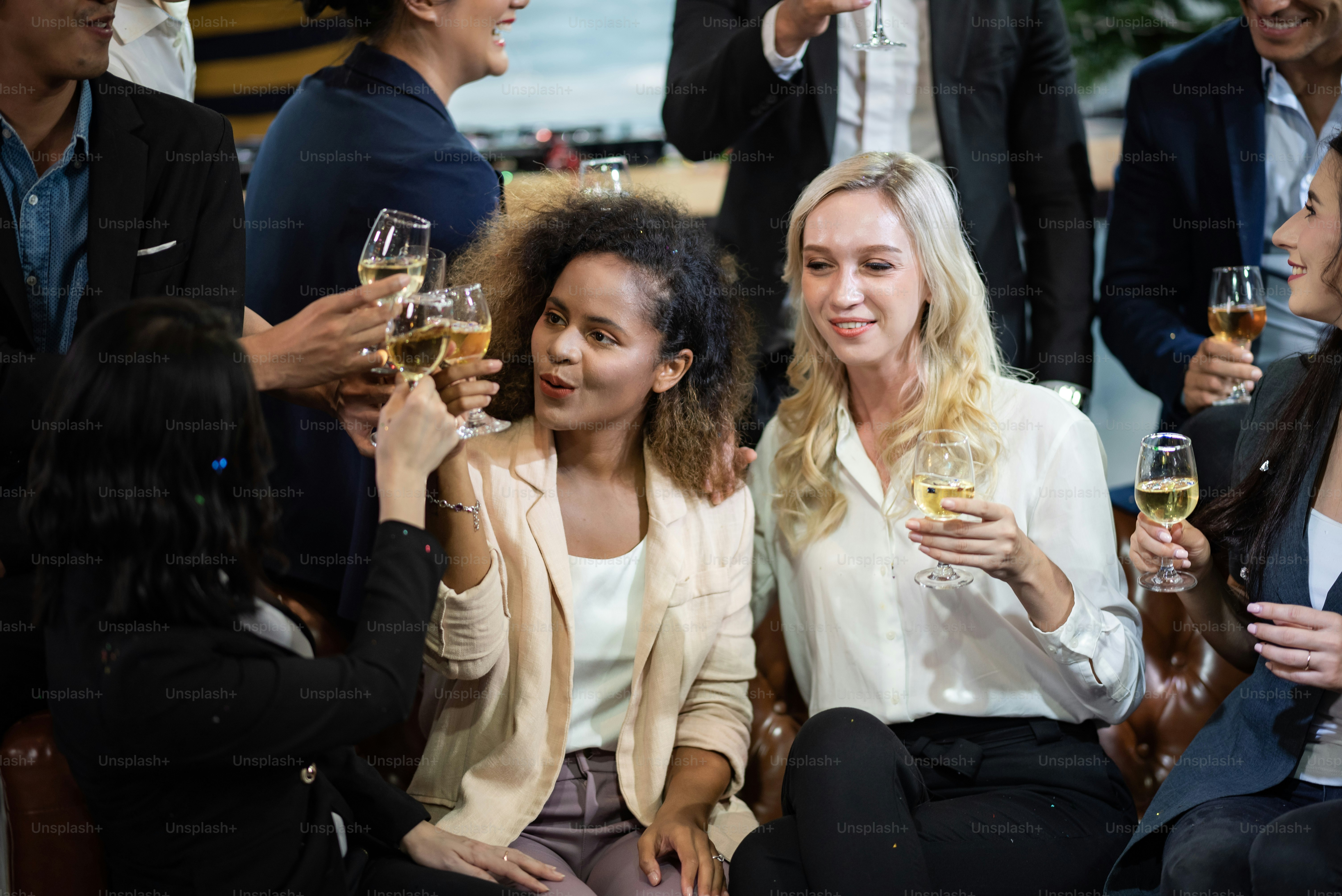Toast to success. Group of business people toasting with champagne and ...