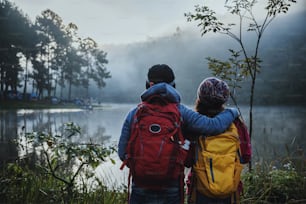 Couple lovers travel Beatiful nature at Pang ung lake and pine forest at Mae Hong Son in Thailand.