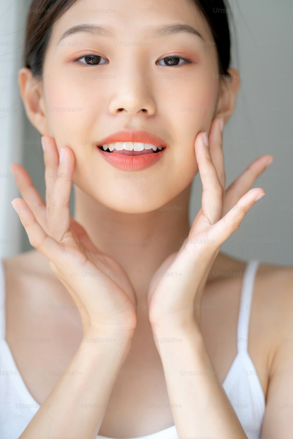 beautiful asian woman white tshirt smile with happiness hand touch face healthy skincare concept morning light day