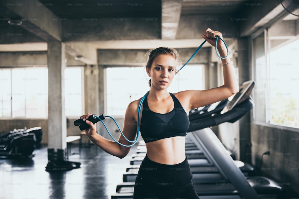 young woman exercising in the sport gym