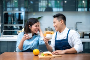 happy young couple have breakfast at home.