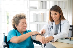 Young female doctor check up the health of elderly female patients