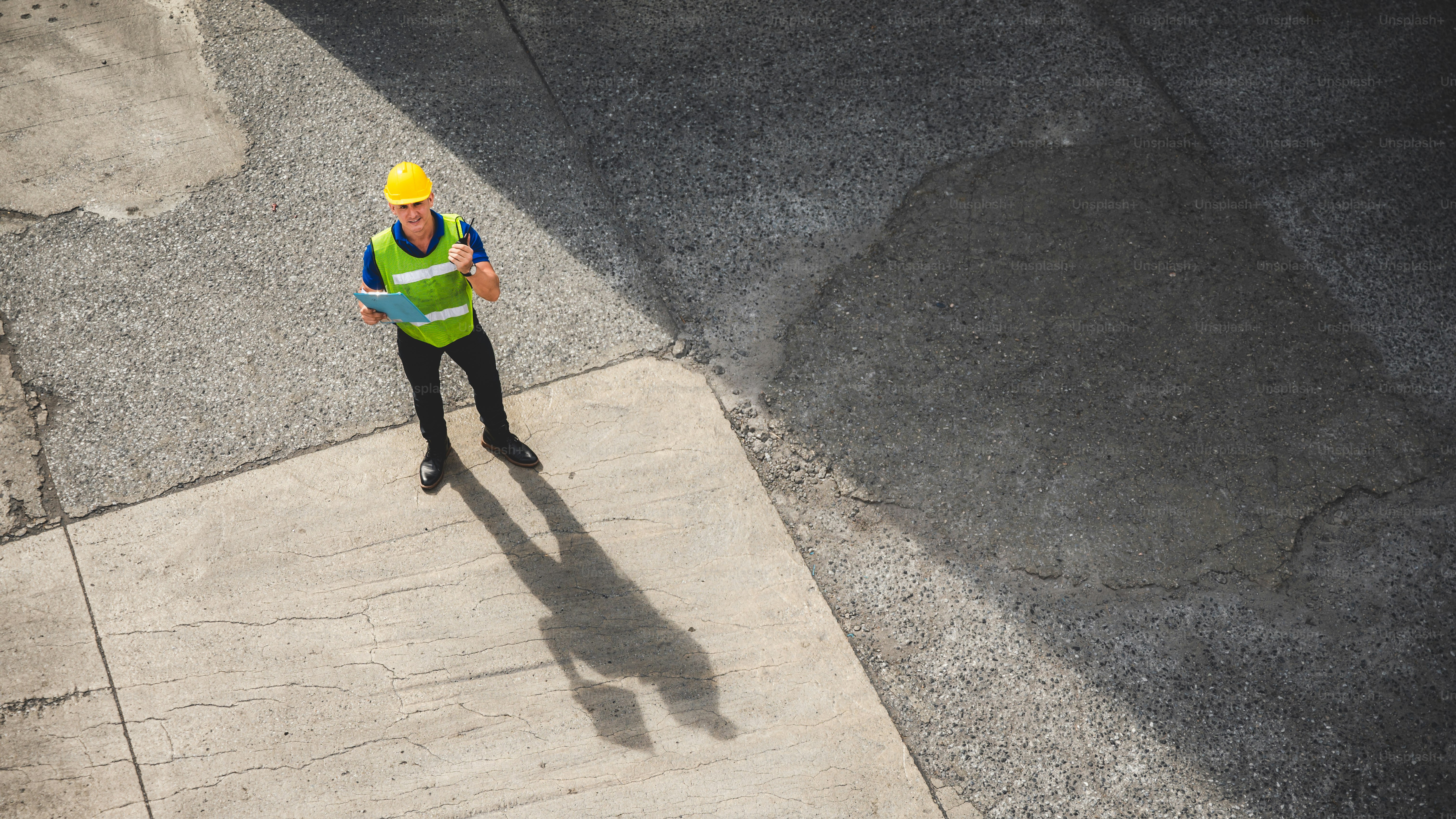 engineer foreman working in container terminal in term of industry logistic cargo shipping to export and import, warehouse delivery business freight transport, loading control in port with safety