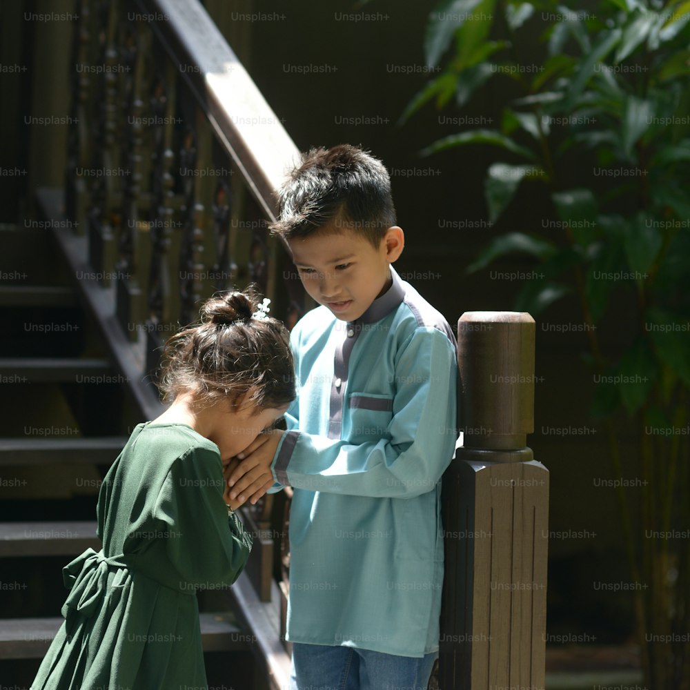 Muslim children greeting, Hari Raya Eid Al-Fitr concept.