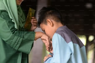 Muslim family greeting, Hari Raya Eid Al-Fitr concept.