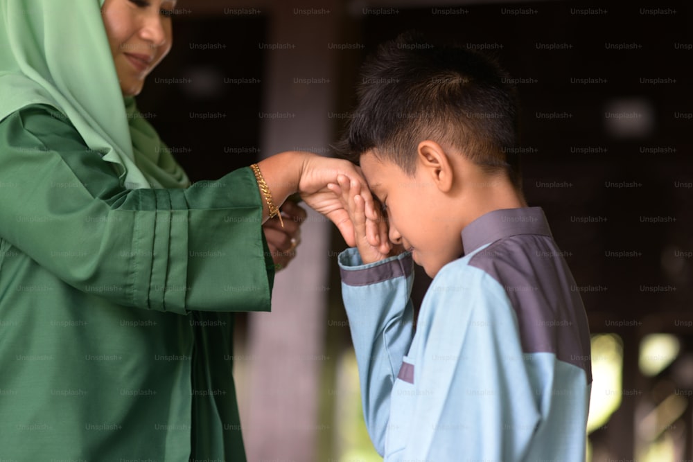 Muslim family greeting, Hari Raya Eid Al-Fitr concept.