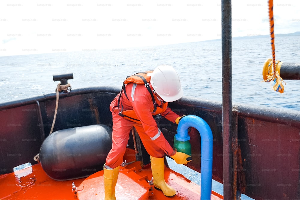 Sailor doing repairs on industrial ship