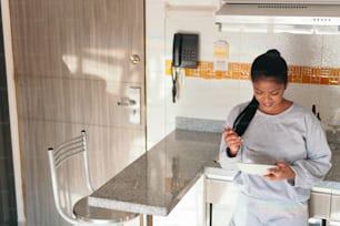 Beautiful black woman having breakfast