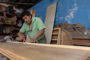 Mexican woodworker, carpenter working in his workshop