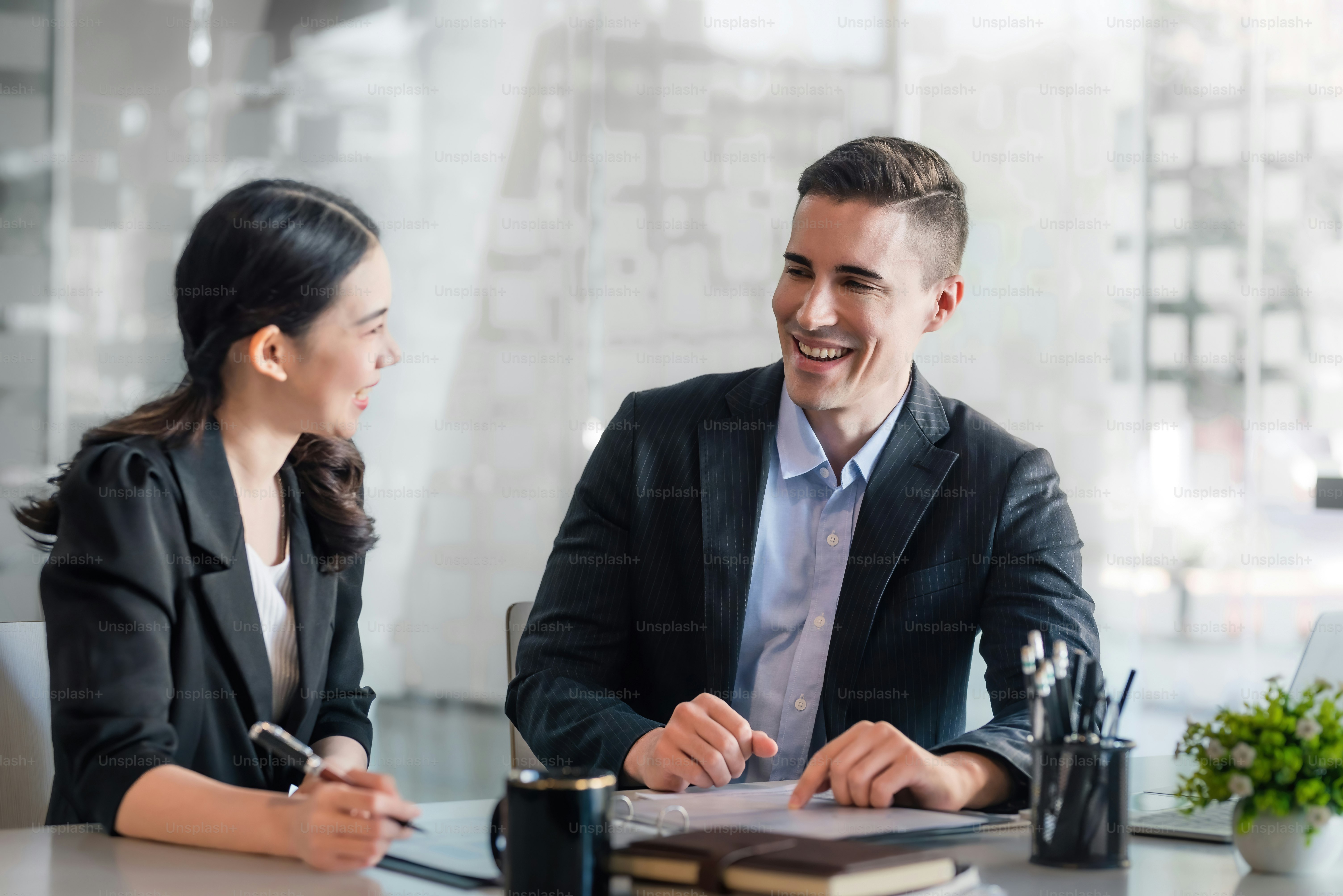 Businessman and businesswoman work together at office