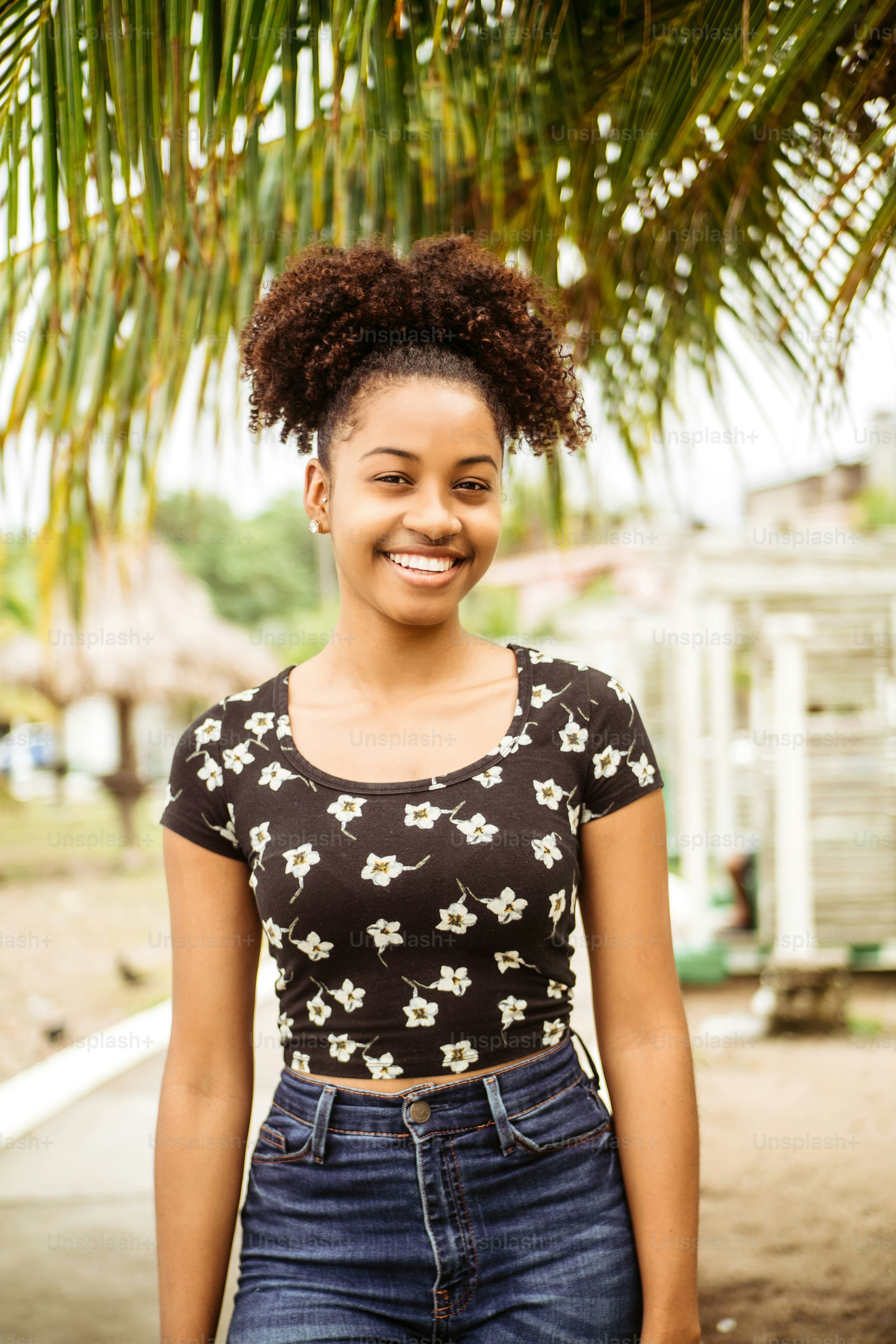 Vertical portrait of young african girl student outdoors.