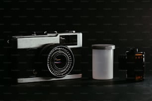 a camera and a container sitting on a table