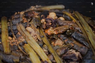 a close up of food in a pan on a stove
