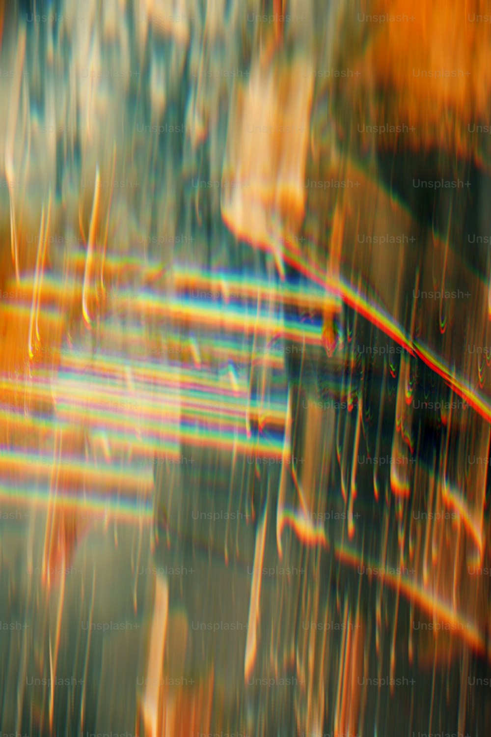 a blurry image of a bench in the rain